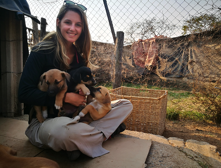 Me with 3 dogs in Africa